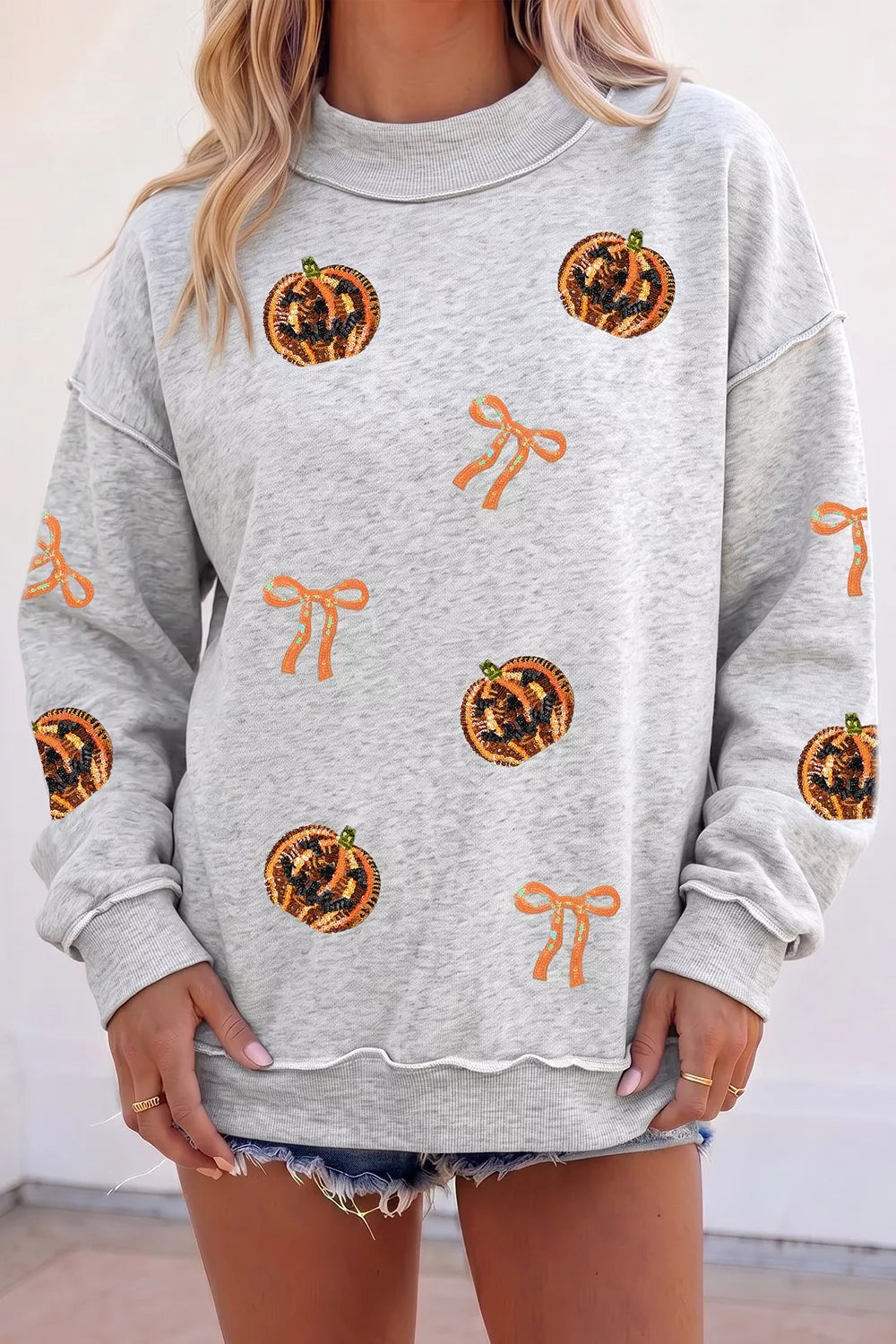 Sequin Pumpkin Face Bow Exposed Seam Halloween Sweatshirt