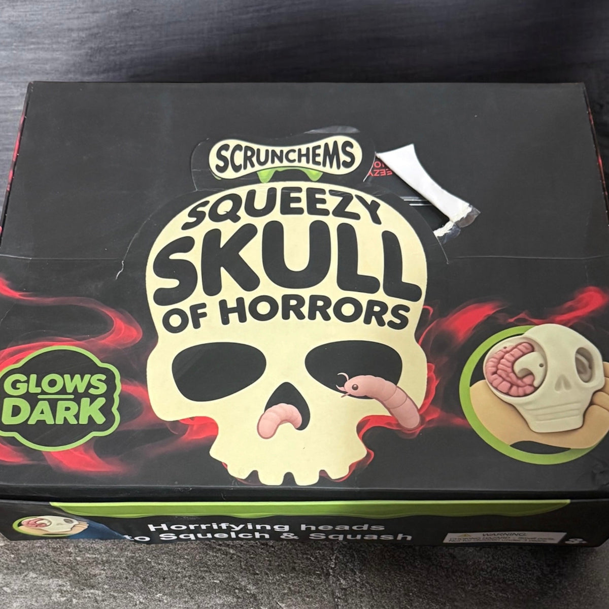 GLOW-IN-THE-DARK HORROR SKULL SQUISHY WITH SURPRISES