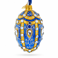 White Scrolls on Blue Glass Egg Ornament 4 Inches